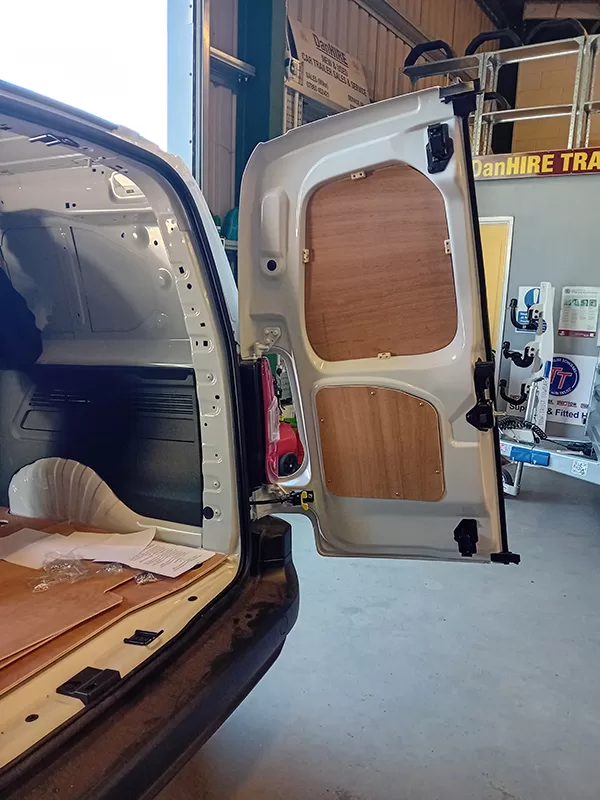 A NEW PEUGEOT PARTNER VAN in the DANHIRE WORKSHOPS being fitted with full Ply Lining, and finished with hard wearing Commercial Rubber Matting.